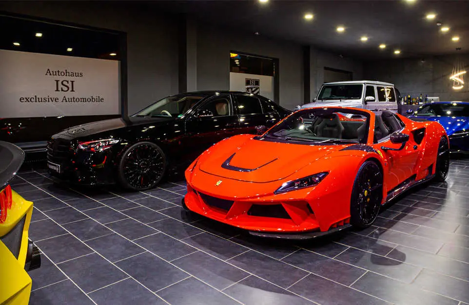 Red Ferrari in front of the Autohaus ISI exclusive Automobile wall lettering